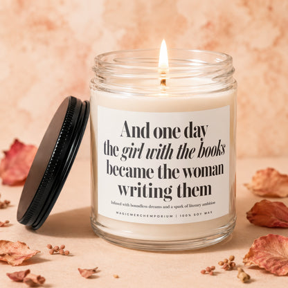 Lit candle with text "And one day the girl with the books became the woman writing them".