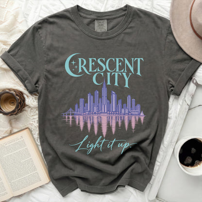 Gray t-shirt with "CRESCENT CITY" and "Light it up" text and cityscape.