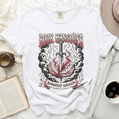 White t-shirt with "BOOK HANGOVER" graphic and a sword through a burning book.