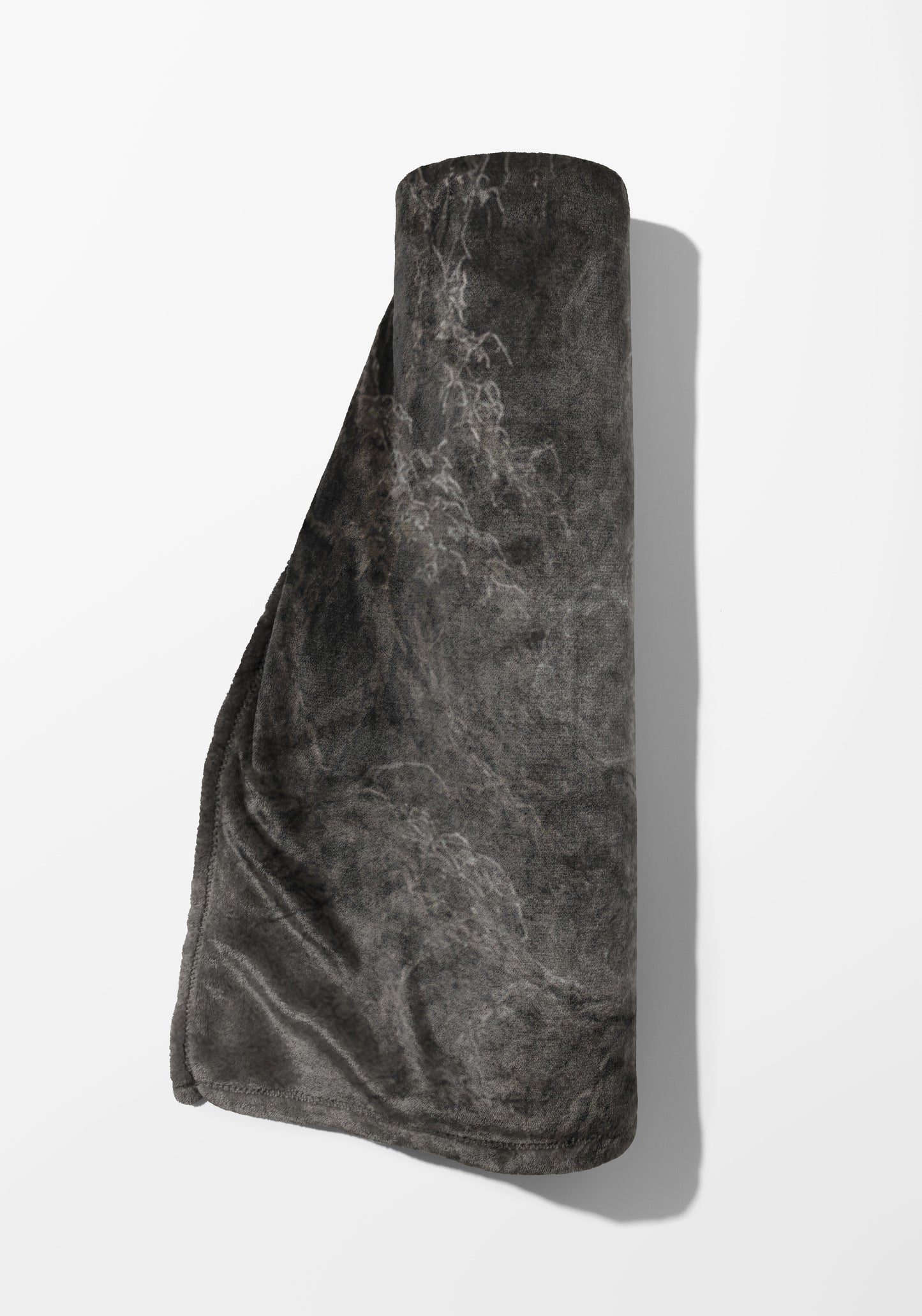 Dark gray rolled blanket with a mottled pattern and slight sheen on a white background.