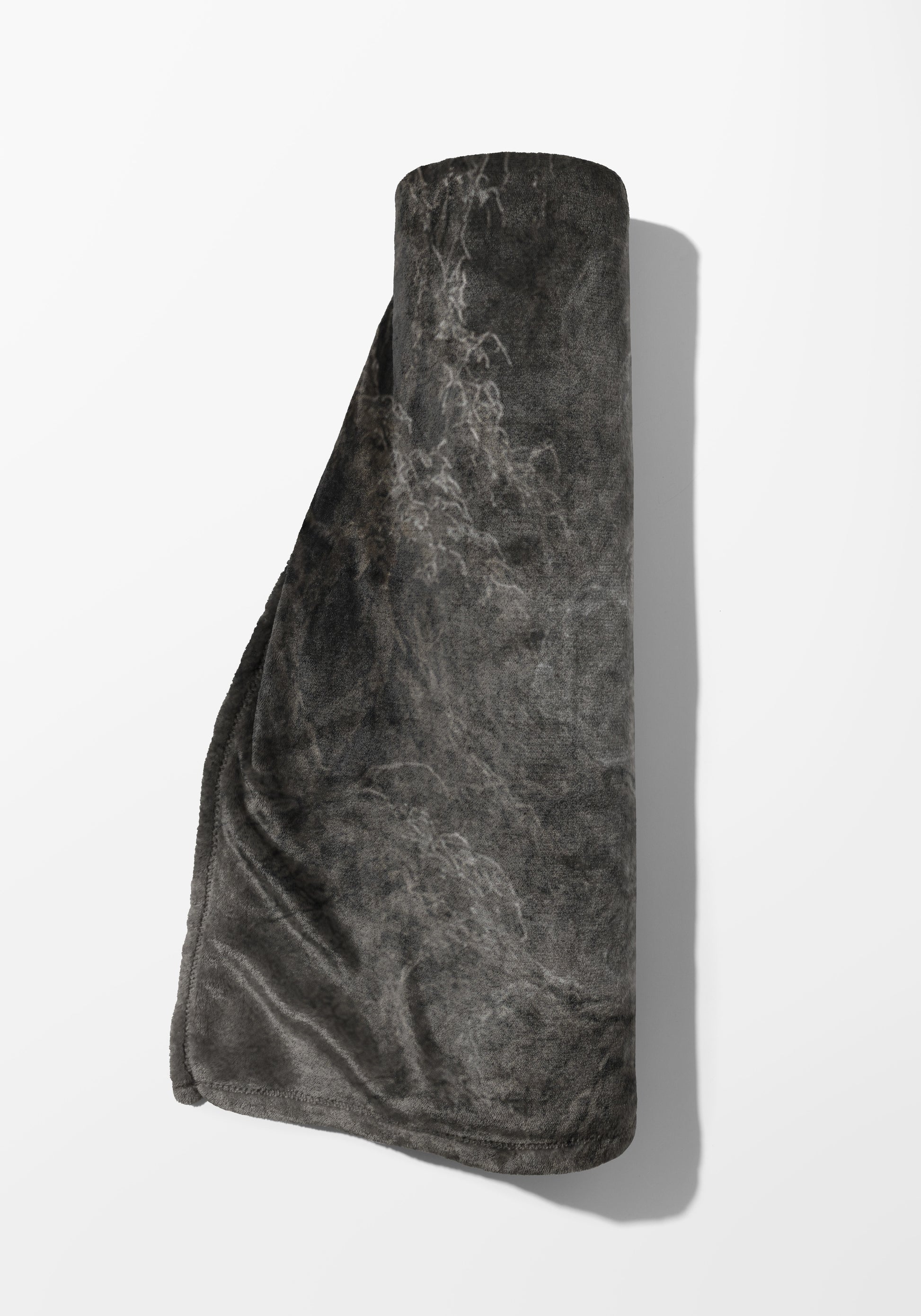 Dark gray rolled blanket with a mottled pattern and slight sheen on a white background.