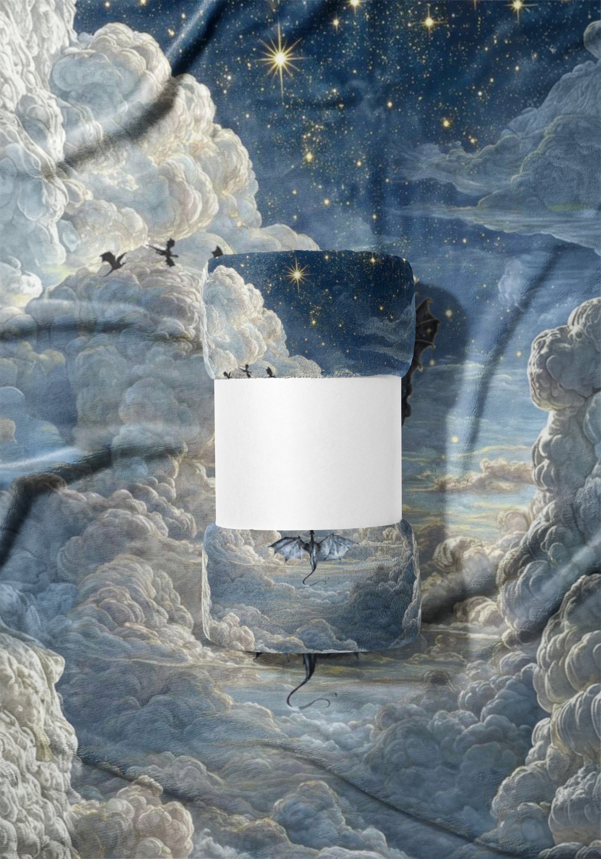 Woven blanket with fantasy dragons, clouds, and stars design.