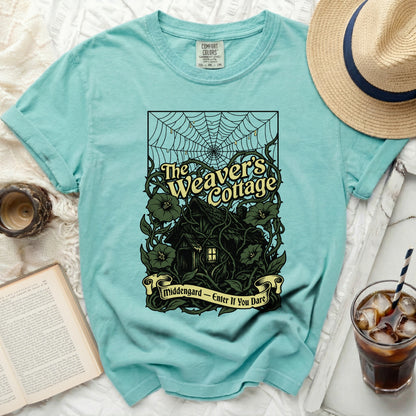 Teal t-shirt with "The Weaver's Cottage" and "Middengard - Enter If You Dare" graphic.