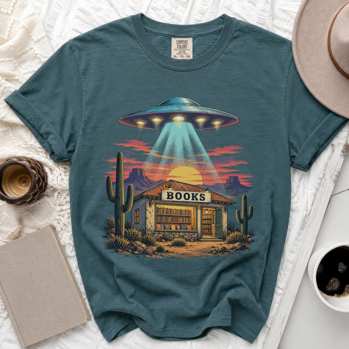 UFO beams light onto a desert bookstore with a "BOOKS" sign.