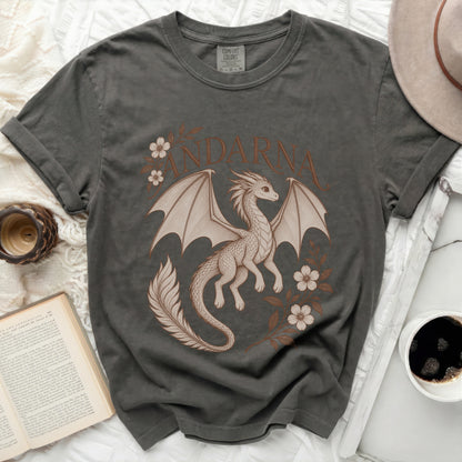 A dark gray t-shirt featuring a beige illustration of a dragon surrounded by flowers and the text ANDARNA.