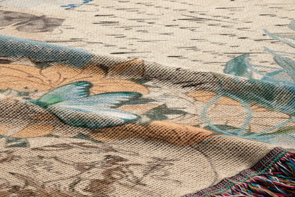 The image is a close-up of a fabric with a floral pattern, featuring a butterfly and other floral elements. The fabric appears to be a woven or knitted material with a textured surface.