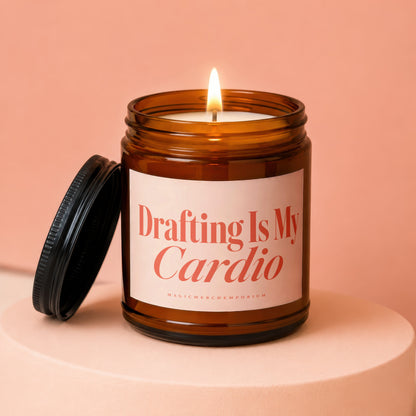 Amber jar candle with burning wick and "Drafting Is My Cardio" text.