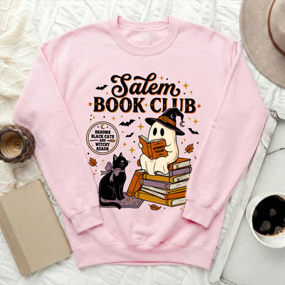 Pink sweatshirt with Salem Book Club graphic featuring a ghost reading and a black cat.
