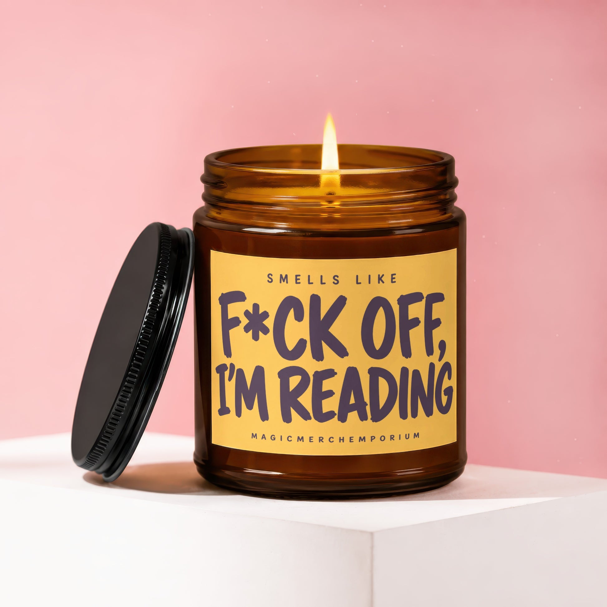 Candle with label stating "Smells like F*ck Off, I'm Reading".