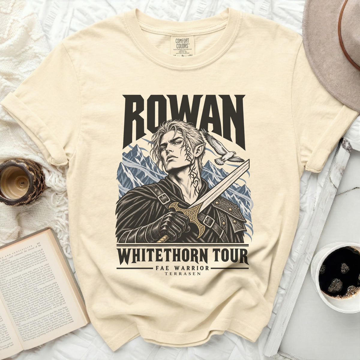 Cream t-shirt with Rowan "Whitethorn Tour Fae Warrior Terrasen" graphic.