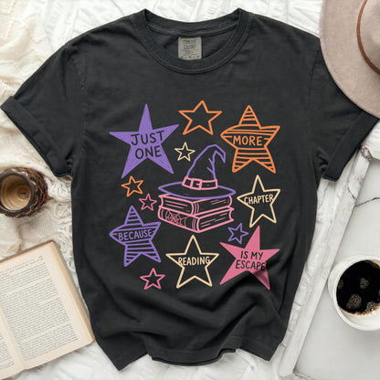 Black t-shirt with wizard hat, books, and stars graphic reading "Just One More Chapter Because Reading Is My Escape".