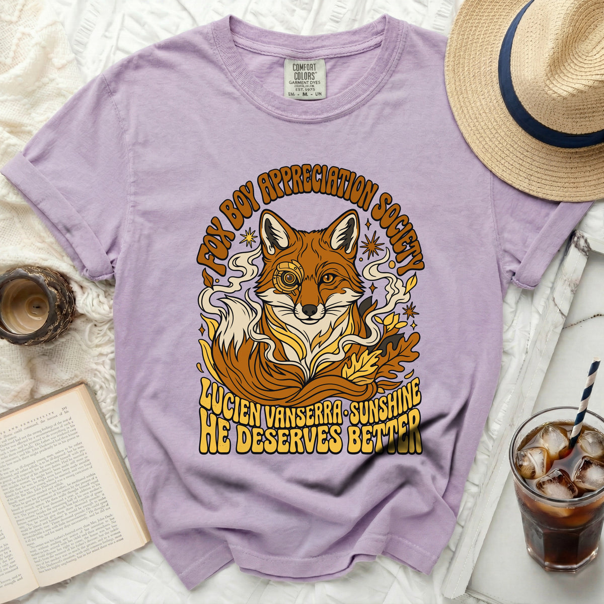Purple t-shirt with a graphic of a fox wearing a monocle, and text reading "Fox Boy Appreciation Society."