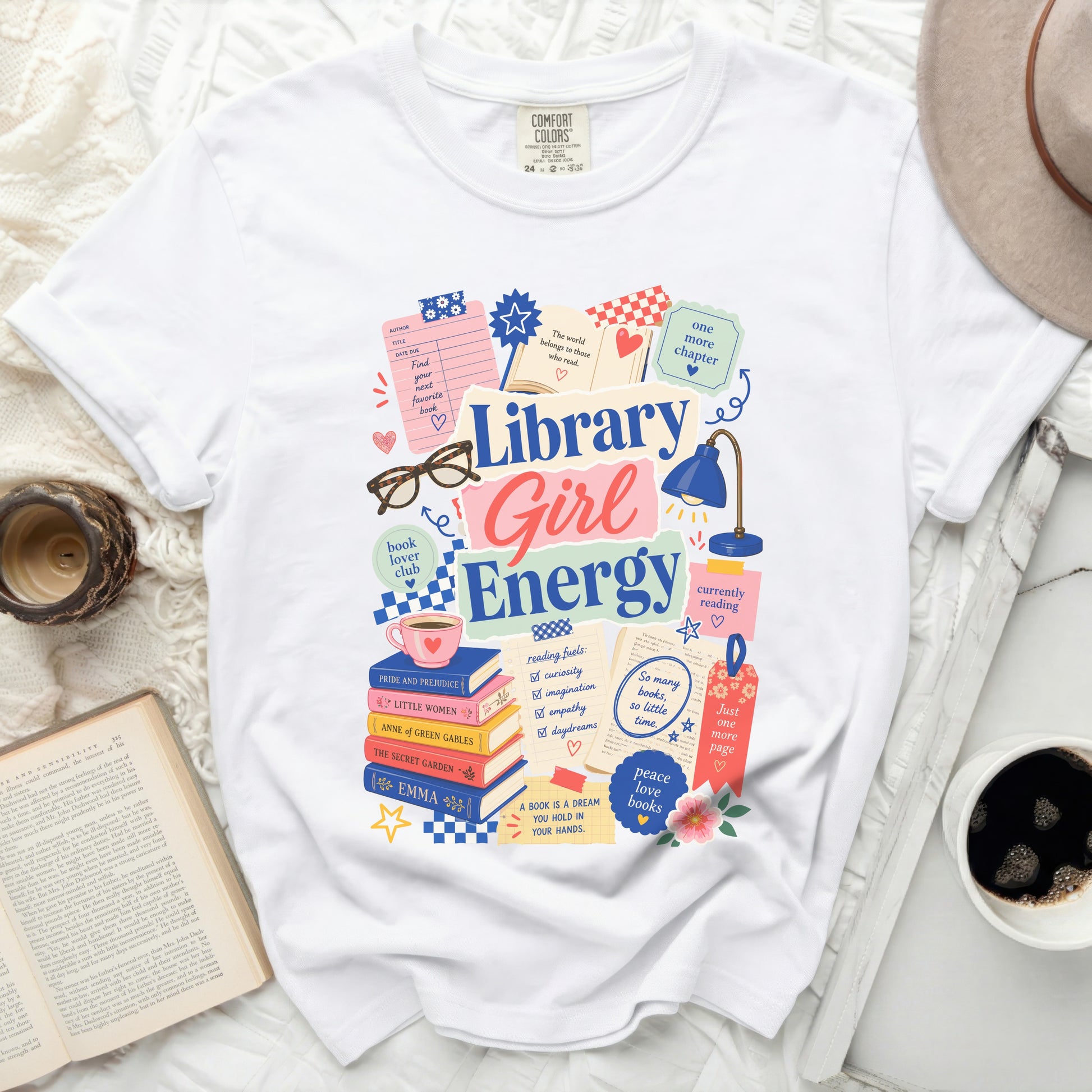 White t-shirt with "Library Girl Energy" graphic and book-themed illustrations.