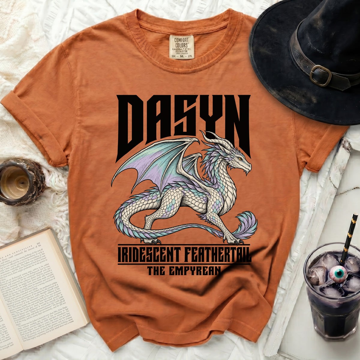 Orange t-shirt with a white iridescent dragon and text "DASYN IRIDESCENT FEATHERTAIL THE EMPYREAN".