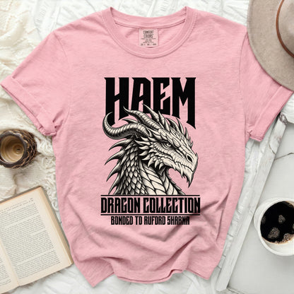 Pink t-shirt with black dragon graphic and text HAEM, DRAGON COLLECTION, BONDED TO RUFORD SHARNA.