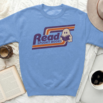 Light blue sweatshirt with "Read Spooky Books" and a ghost reading a book.