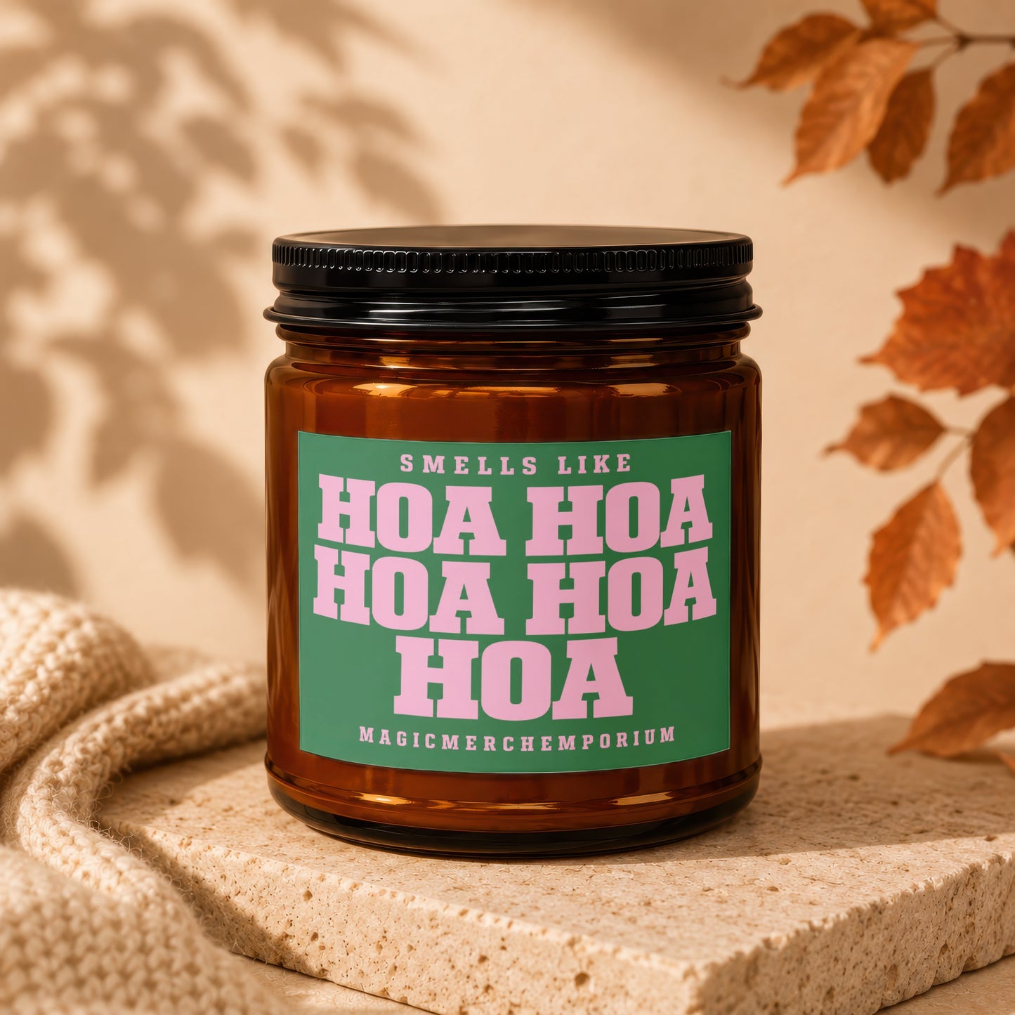 Amber jar candle with green label reading "Smells Like Hoa Hoa Hoa Hoa Magicmerchemporium."