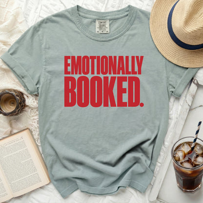 Light blue t-shirt with red text reading "EMOTIONALLY BOOKED."