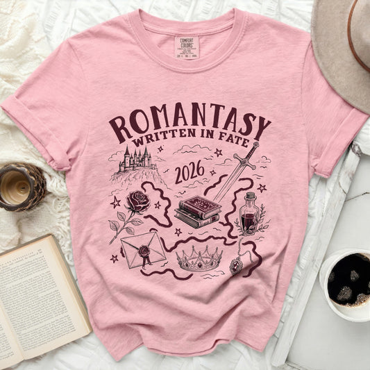 Pink t-shirt with "ROMANTASY WRITTEN IN FATE 2026" graphic.