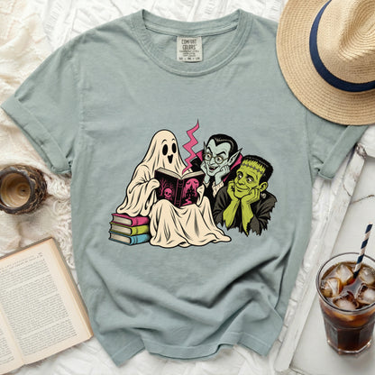Ghost, vampire, and Frankenstein characters reading a spooky book.