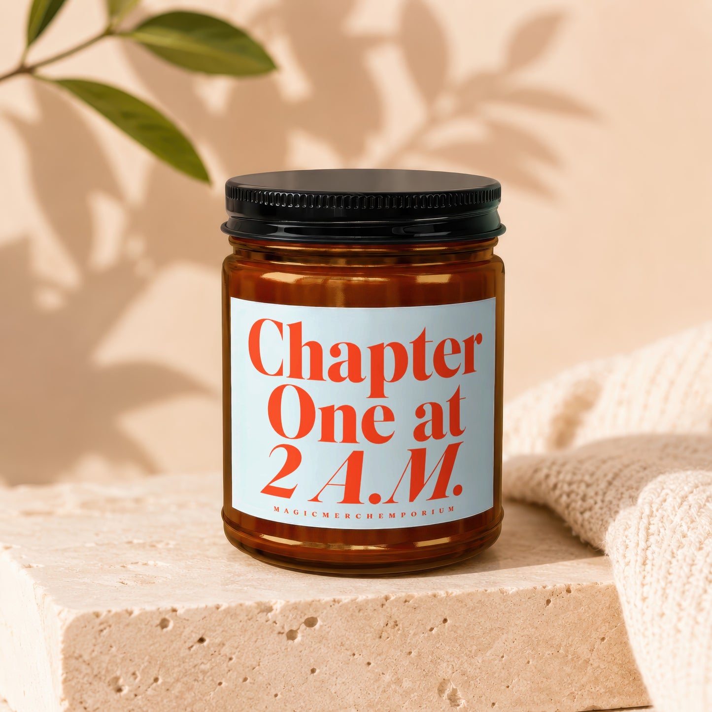 Candle with text "Chapter One at 2 A.M." on light blue label.