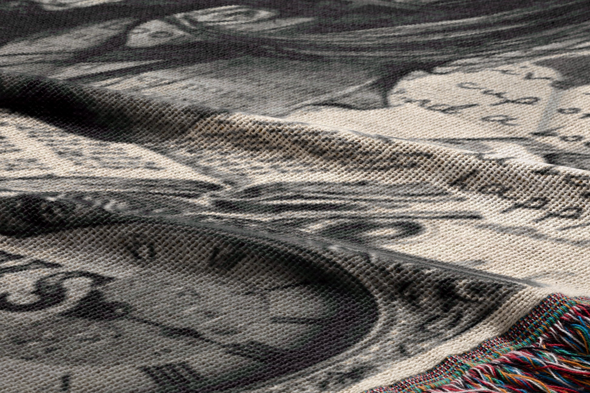 The image is a close-up of a fabric with a printed design, featuring a clock and other abstract shapes. The fabric appears to be a blanket or textile with a textured surface.