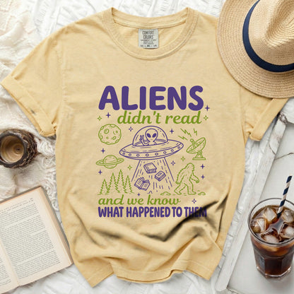 Yellow t-shirt with graphic text "ALIENS didn't read and we know WHAT HAPPENED TO THEM".