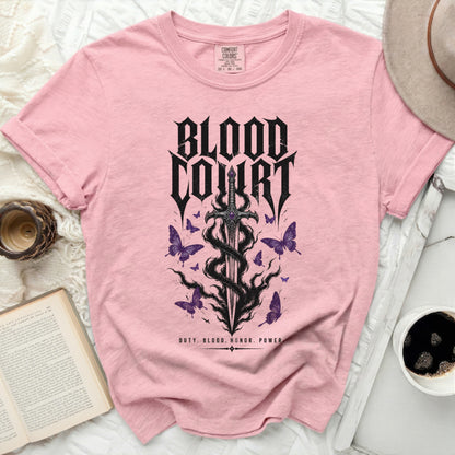 Pink t-shirt with "Blood Court" text, sword, and butterflies graphic.