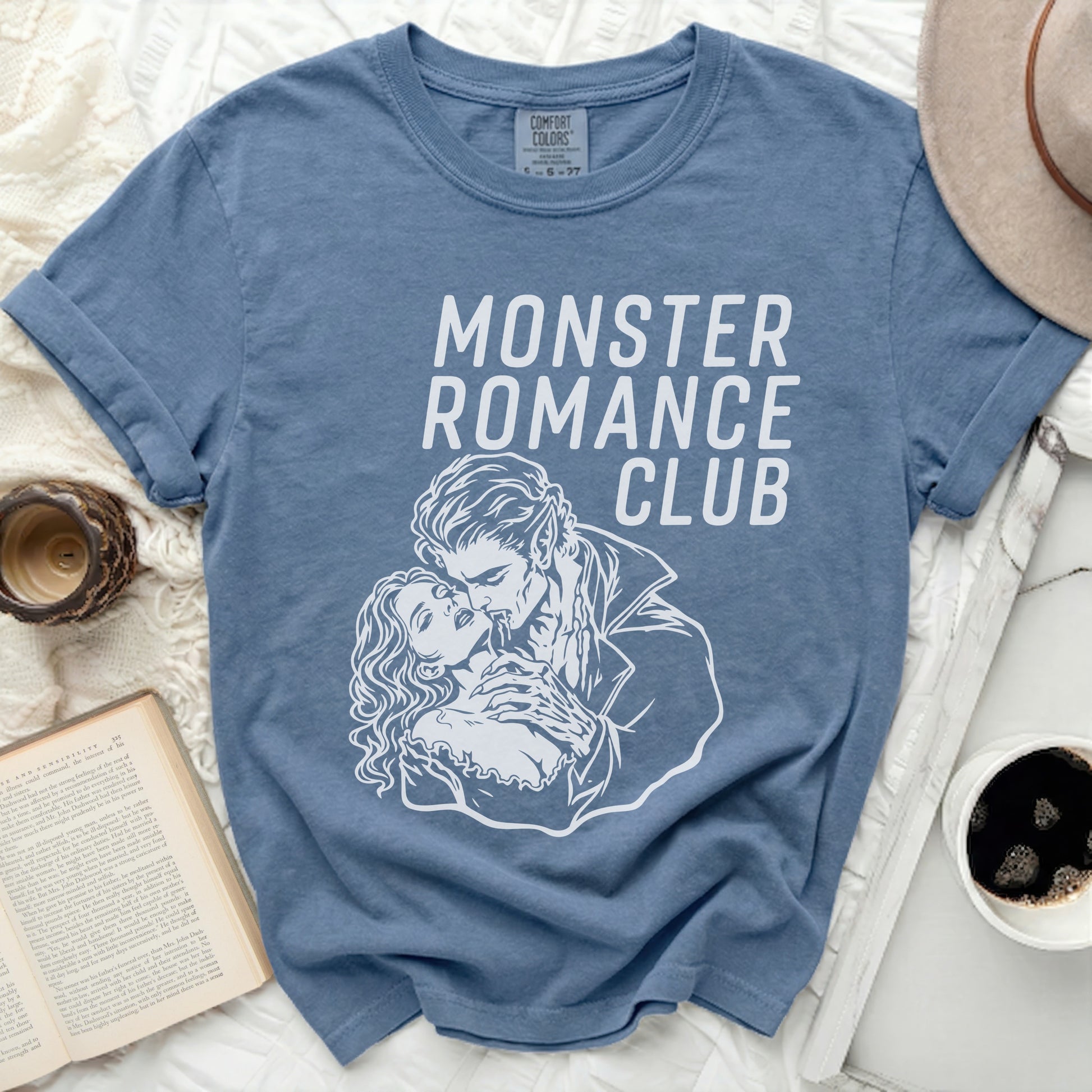 Blue t-shirt with white Monster Romance Club graphic and vampire couple.