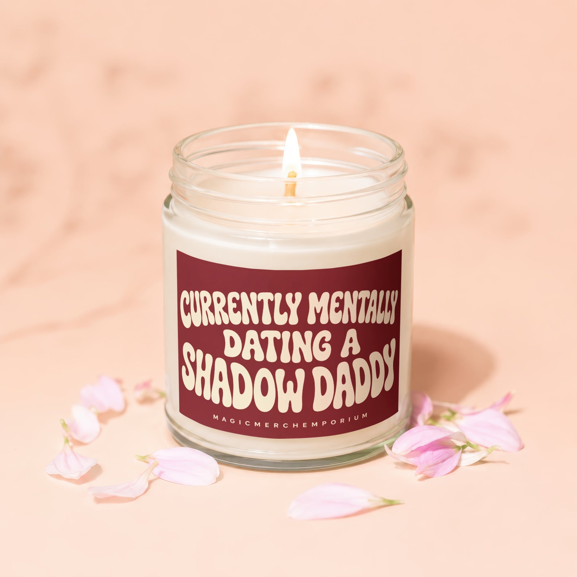 Burning candle with "Currently Mentally Dating a Shadow Daddy" text on label.