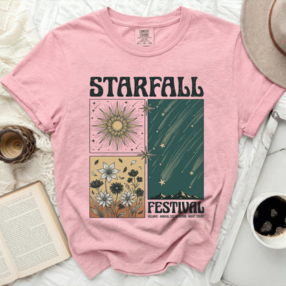 Pink t-shirt with "STARFALL FESTIVAL" graphic of sun, flowers, and meteors.