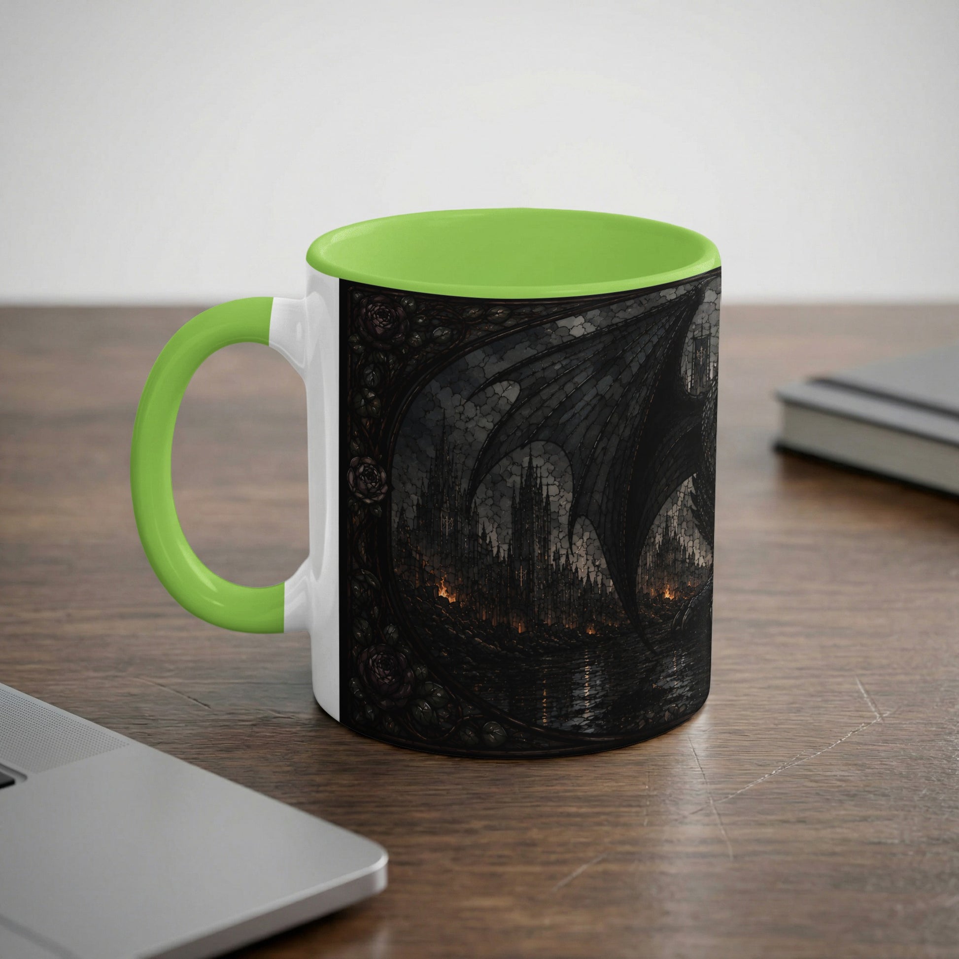 Mug with a gothic castle and dragon wing design and a bright green handle and interior.