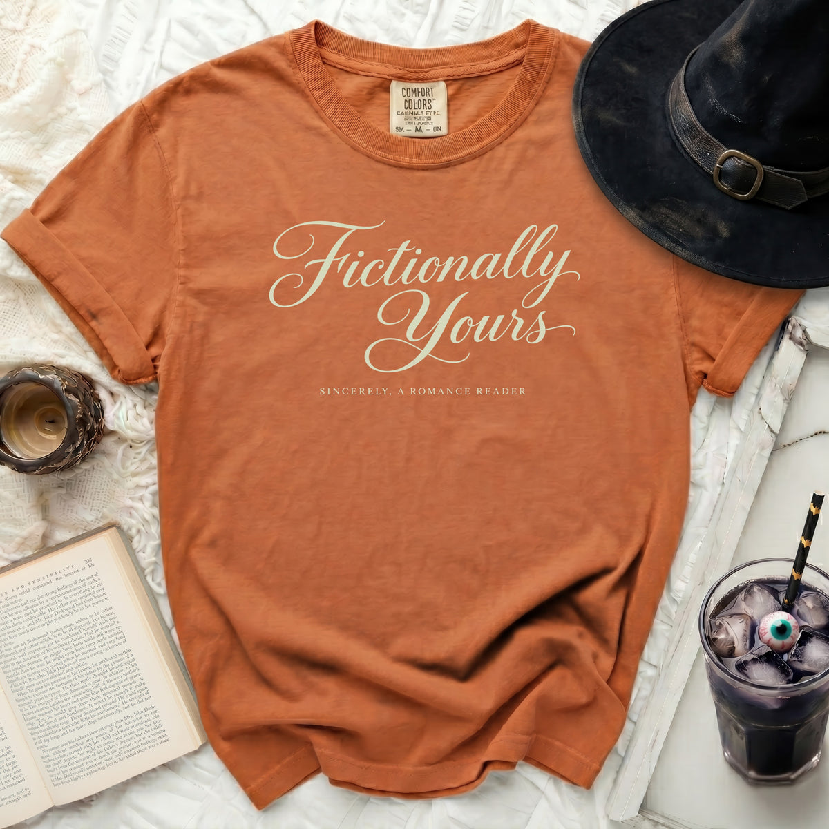 Orange Comfort Colors t-shirt with "Fictionally Yours" and "Sincerely, A Romance Reader" text.