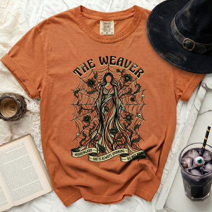 Orange t-shirt with "The Weaver" graphic and spiderweb design.