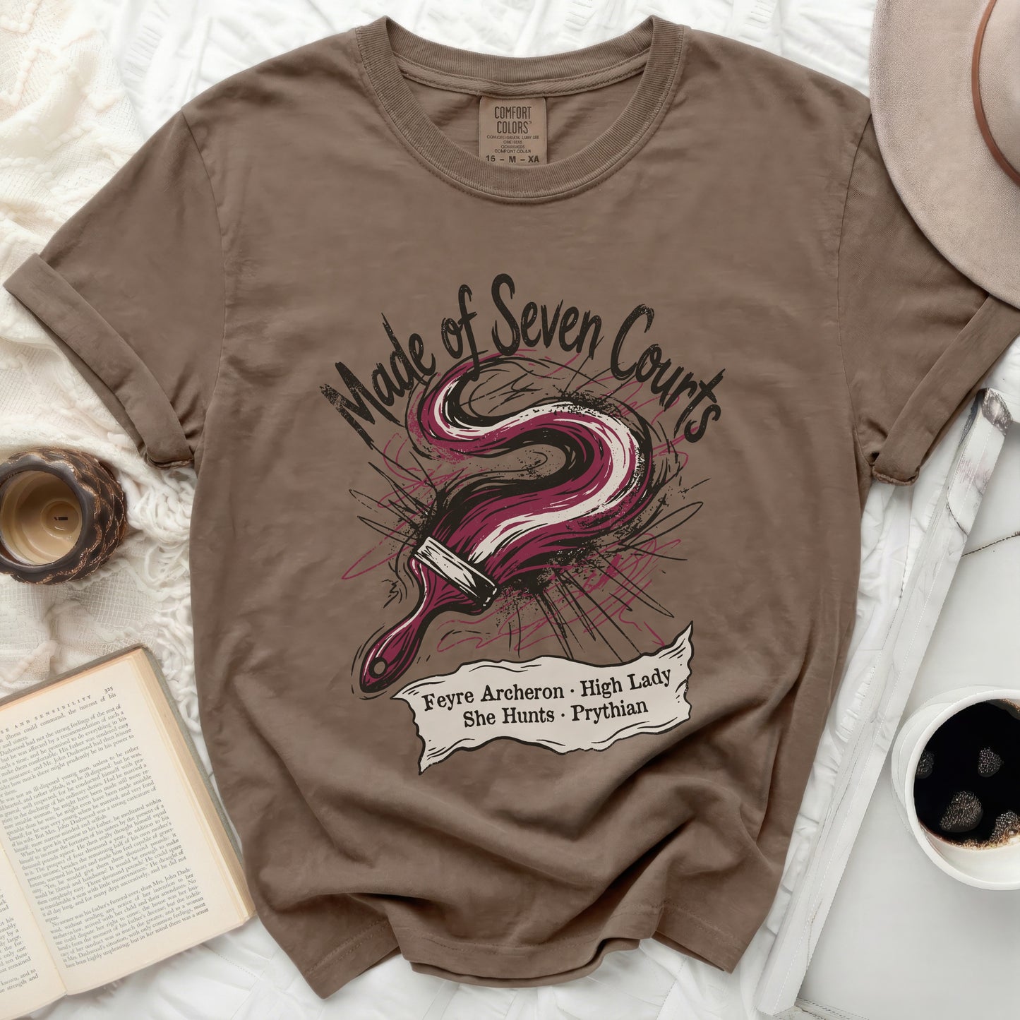 T-shirt with "Made of Seven Courts Feyre Archeron High Lady She Hunts Prythian" text and paintbrush graphic.