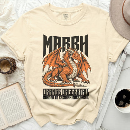 Cream t-shirt with orange dragon graphic and text "MARRH ORANGE DAGGERTAIL".
