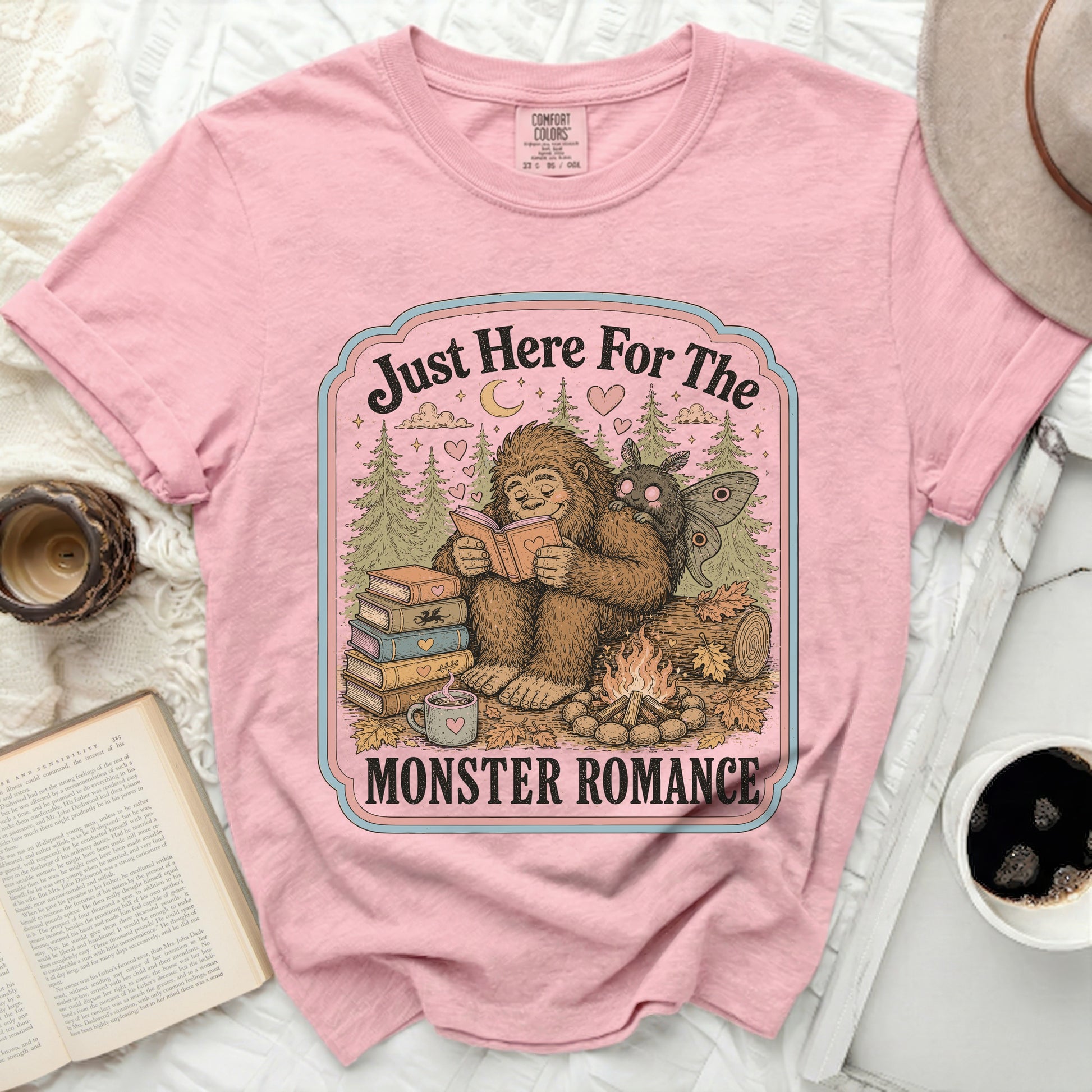 Bigfoot and moth reading books by campfire, text "Just Here For The MONSTER ROMANCE".