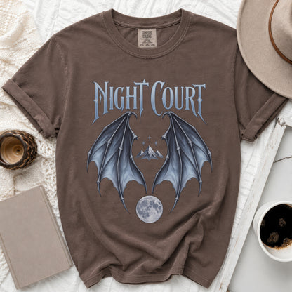 Brown t-shirt with "Night Court" text, bat wings, mountains, and moon graphic.