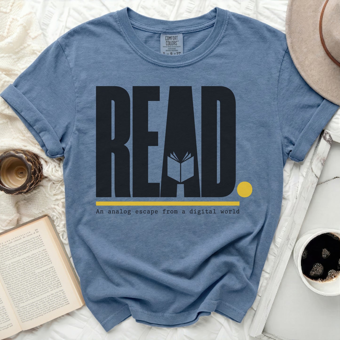 Blue t-shirt with "READ" and "An analog escape from a digital world" text.