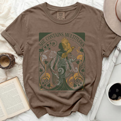 T-shirt with a graphic design of mythical creatures and text.