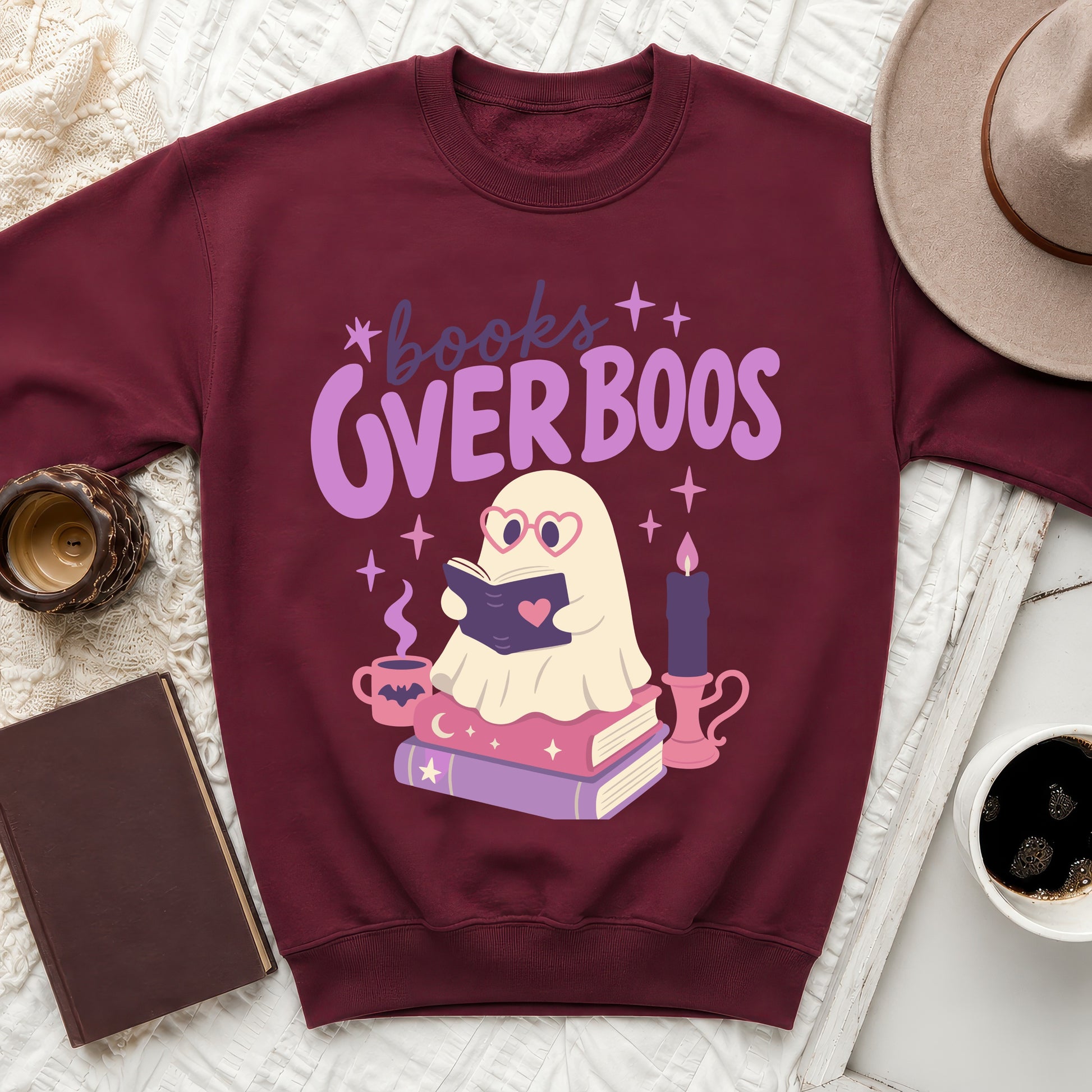 Maroon sweatshirt with "Books Over Boos" graphic featuring a ghost reading a book.