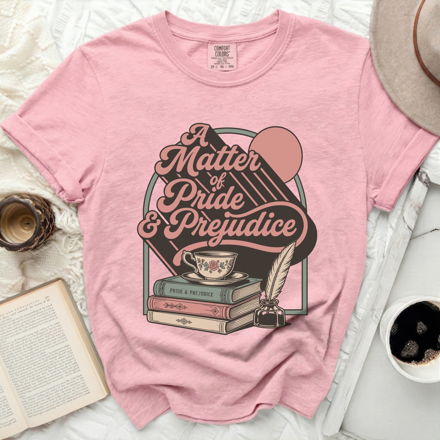 Pink t-shirt with "A Matter of Pride & Prejudice" graphic.