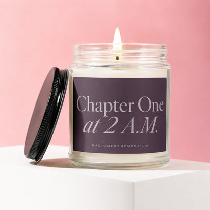 Lit glass jar candle with purple label reading "Chapter One at 2 A.M."
