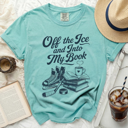 Teal t-shirt with "Off the Ice and Into My Book" text, hockey skates, and books.