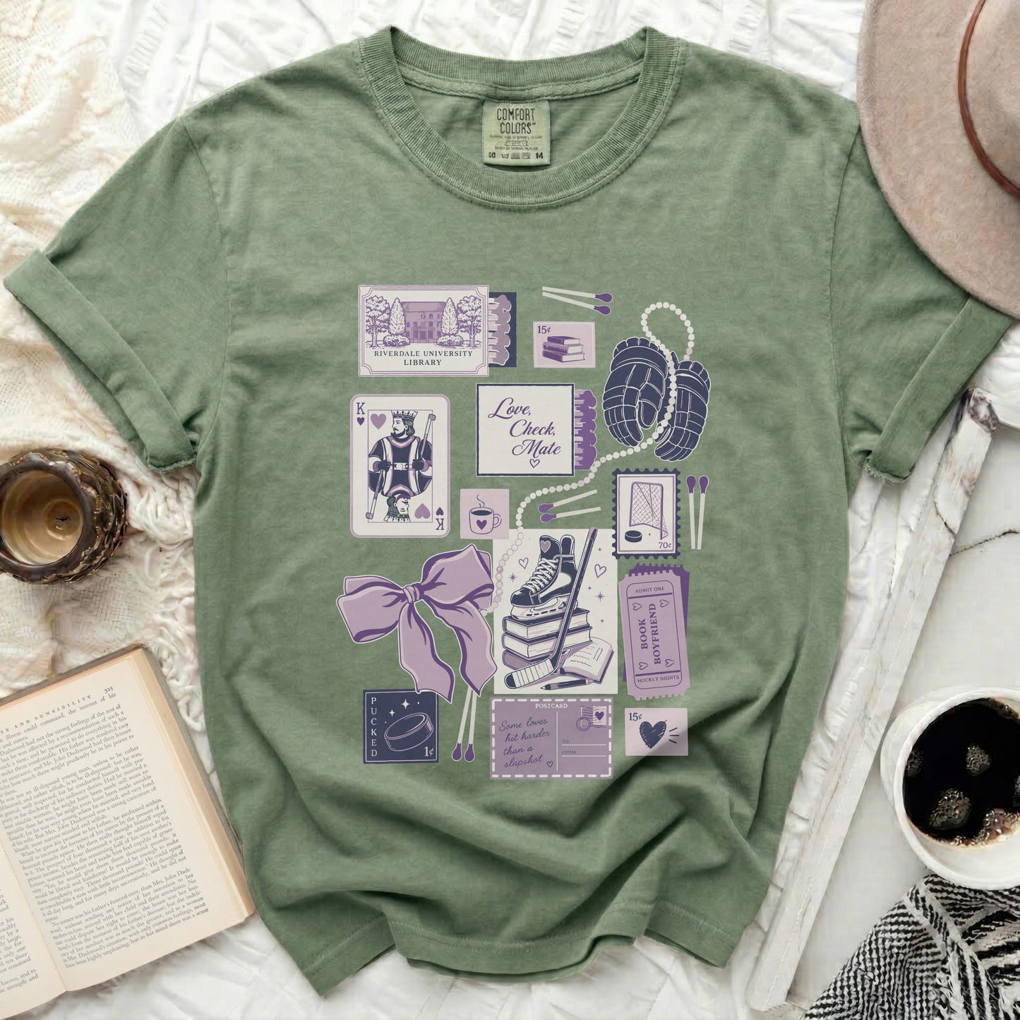 T-shirt with pastel illustrations of library cards, hockey gear, and romantic movie tickets.