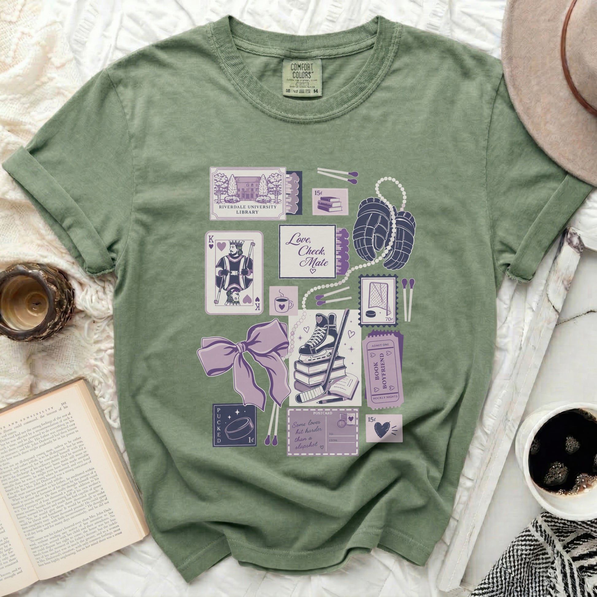 T-shirt with pastel illustrations of library cards, hockey gear, and romantic movie tickets.