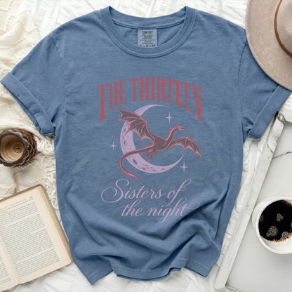 Blue t-shirt with a dragon and crescent moon graphic and text.