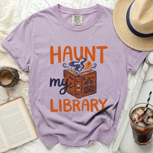Lavender t-shirt with "Haunt my Library" Halloween graphic.