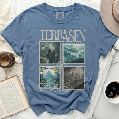 Blue t-shirt with four square fantasy art prints and "TERRASEN" text.
