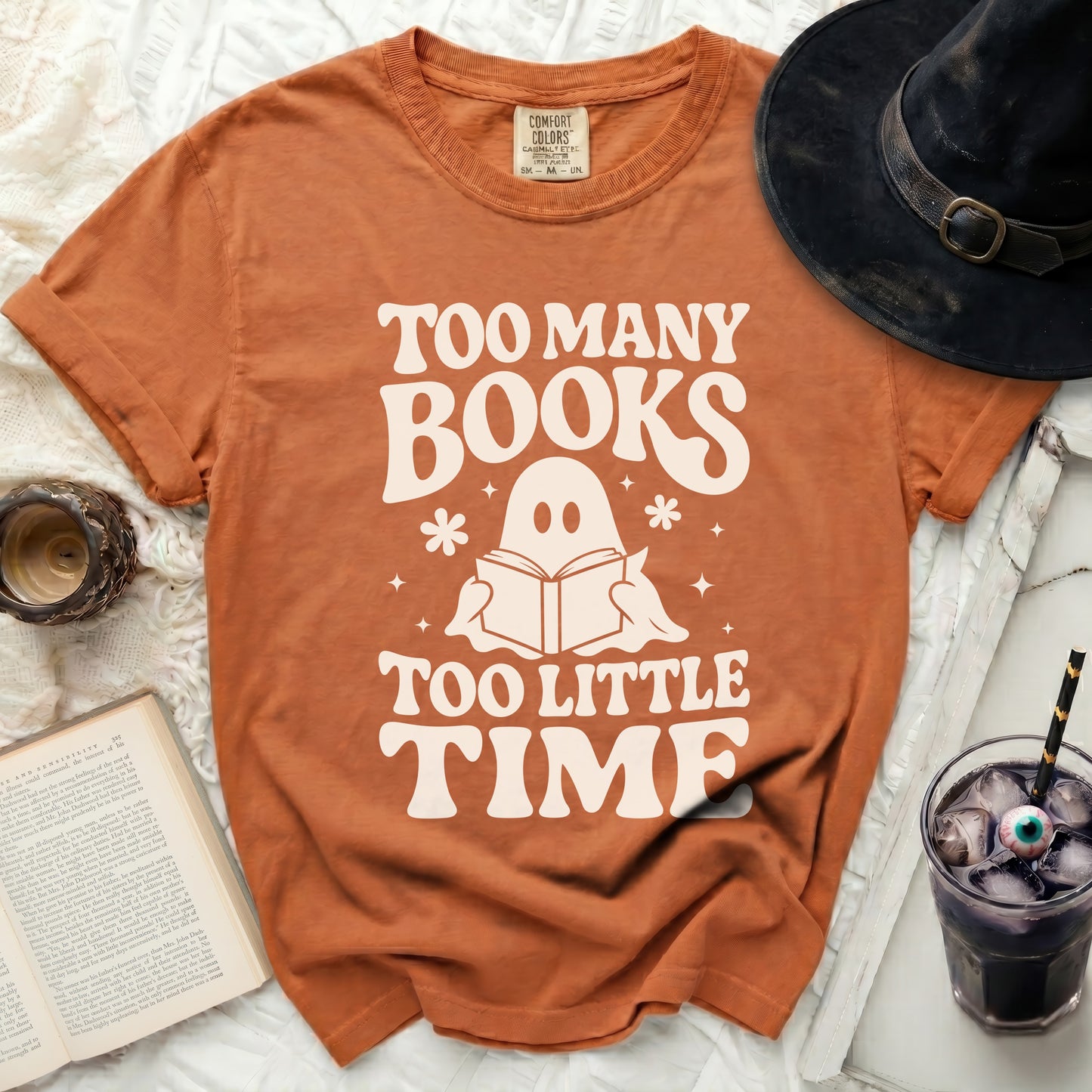 Orange t-shirt with "Too Many Books Too Little Time" and ghost design.